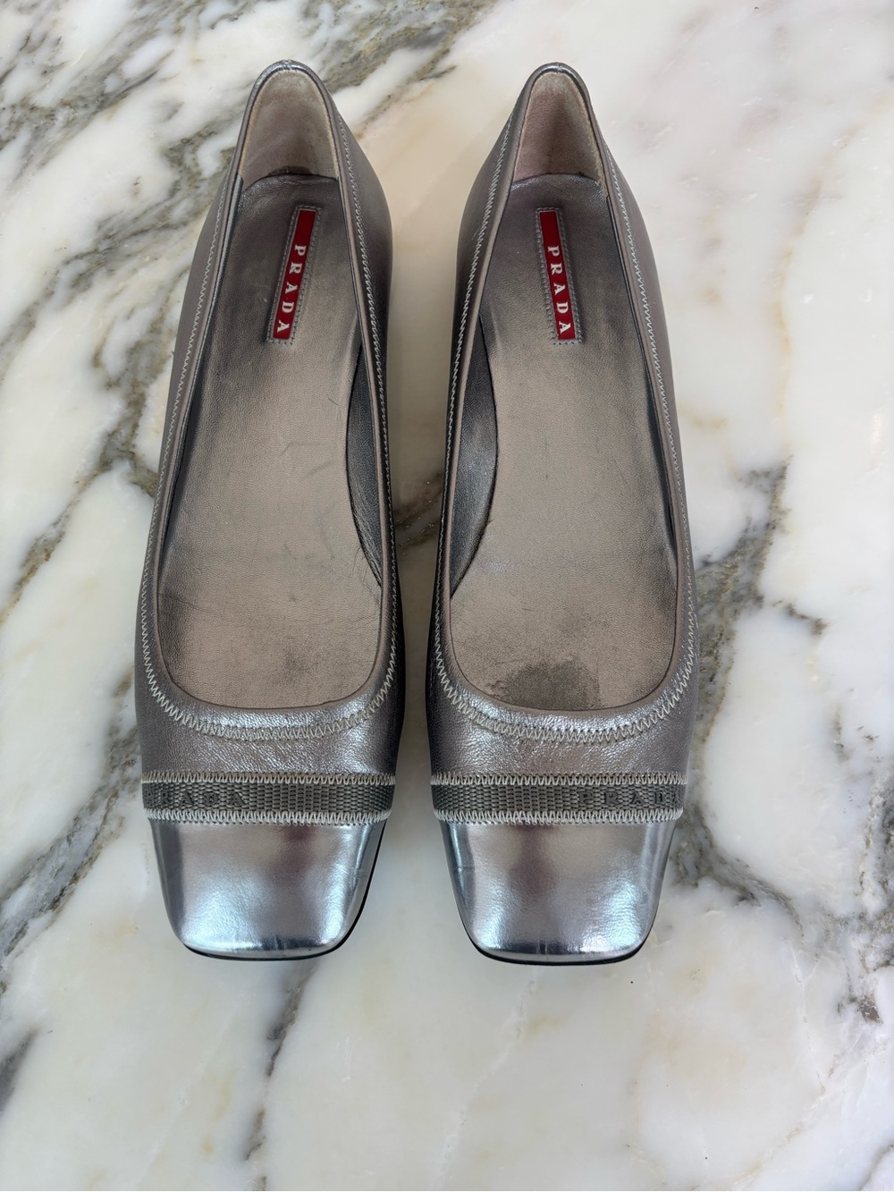Prada Sport metallic pewter cap-toe flats. Size 38.5